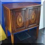F07. Inlaid mahogany cabinet. 32.5”h x 27”w x 18”d 